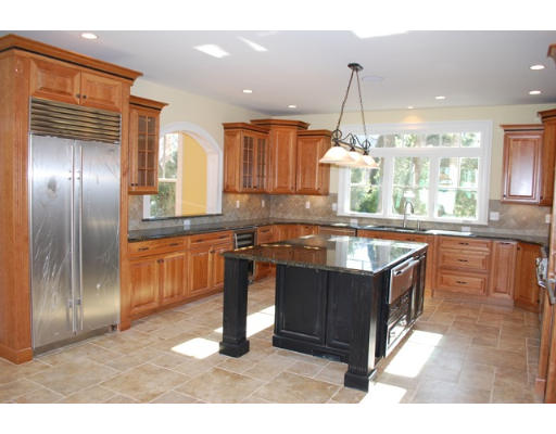 3 Martingale Road, Unit LOT #1 Lexington, MA 02421 - Photo 6 of 10 a kitchen with stainless steel appliances granite countertop a sink and a stove