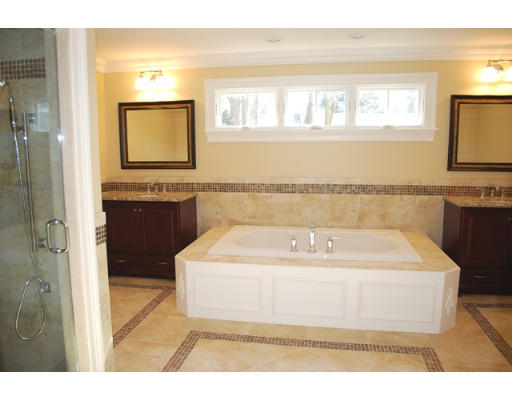 3 Martingale Road, Unit LOT #1 Lexington, MA 02421 - Photo 10 of 10 a bathroom with a bathtub sink and mirror