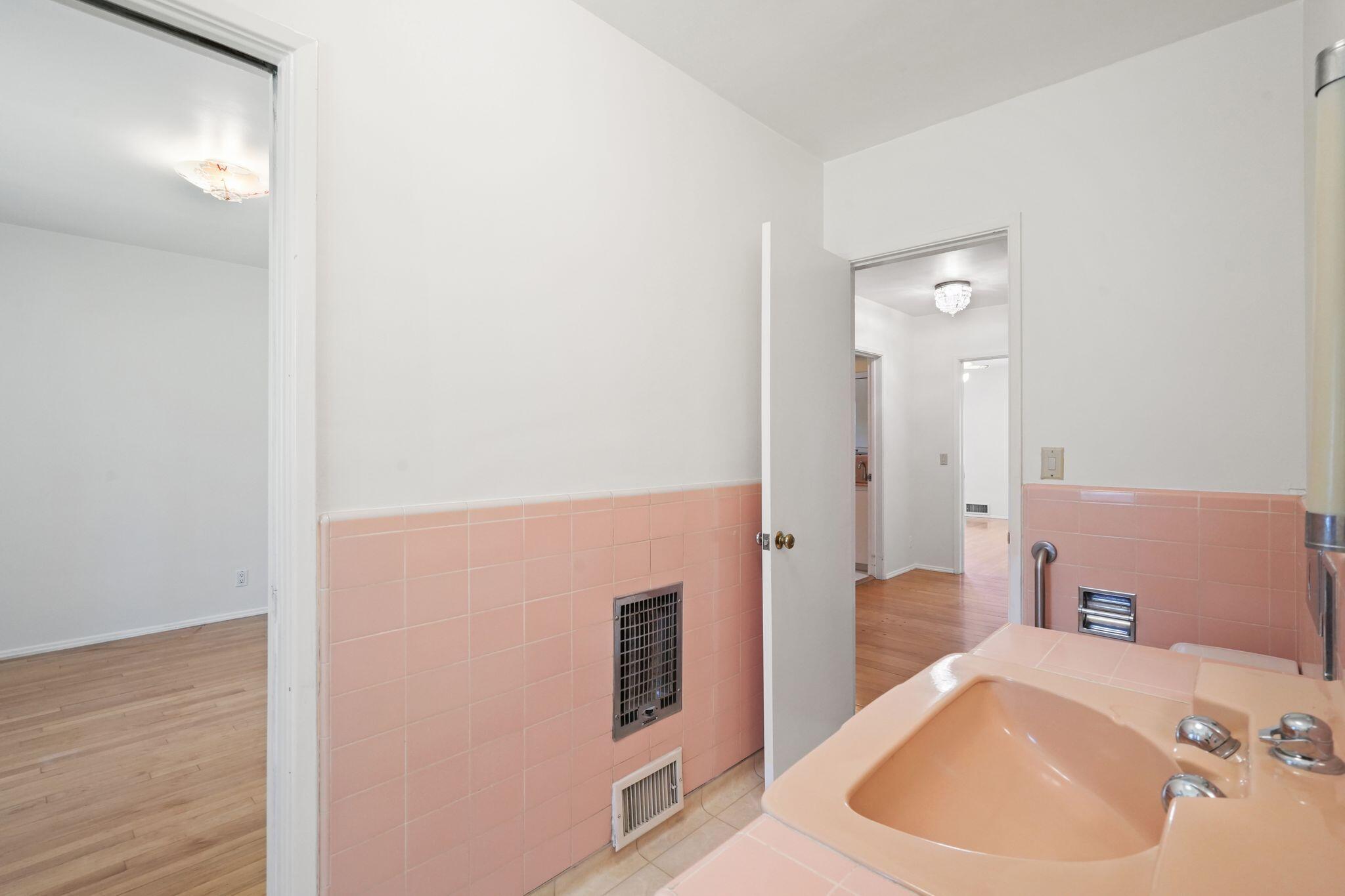 108 West Kenneth Road Glendale, CA 91202 - Photo 18 of 47 a bathroom with a sink and a mirror