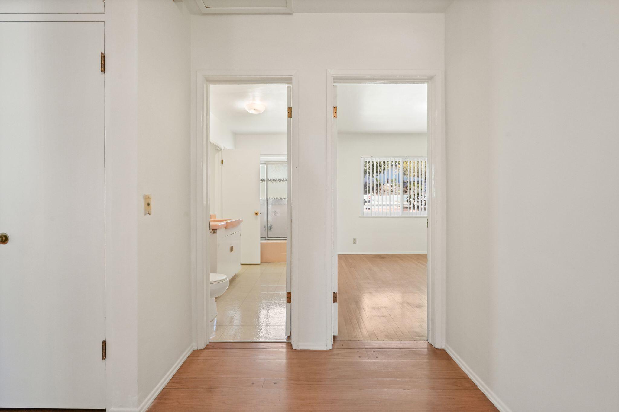 108 West Kenneth Road Glendale, CA 91202 - Photo 24 of 47 a view of a hallway with wooden floor and a bathroom