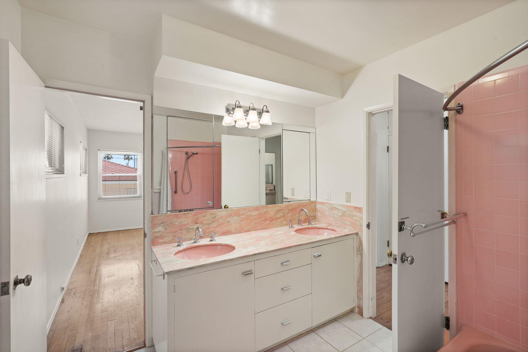 108 West Kenneth Road Glendale, CA 91202 - Photo 27 of 47 a bathroom with a shower sink and mirror