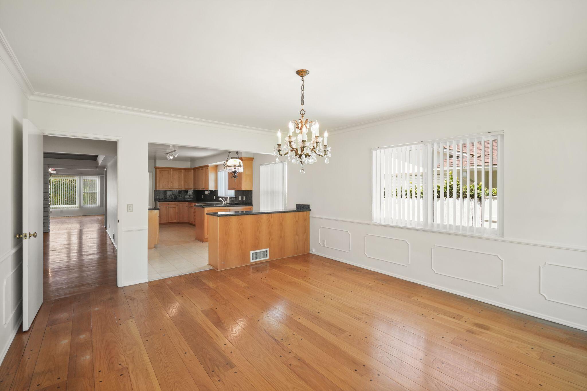 108 West Kenneth Road Glendale, CA 91202 - Photo 32 of 47 a view of a livingroom with a chandelier fan and windows