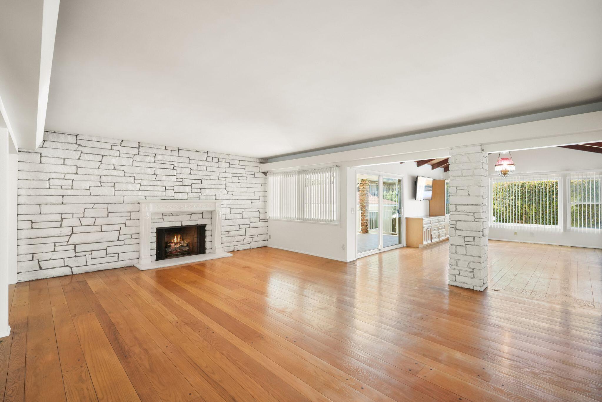108 West Kenneth Road Glendale, CA 91202 - Photo 8 of 47 a view of empty room with wooden floor and fireplace