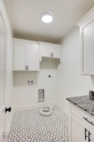 a bathroom with a granite countertop sink and a stove
