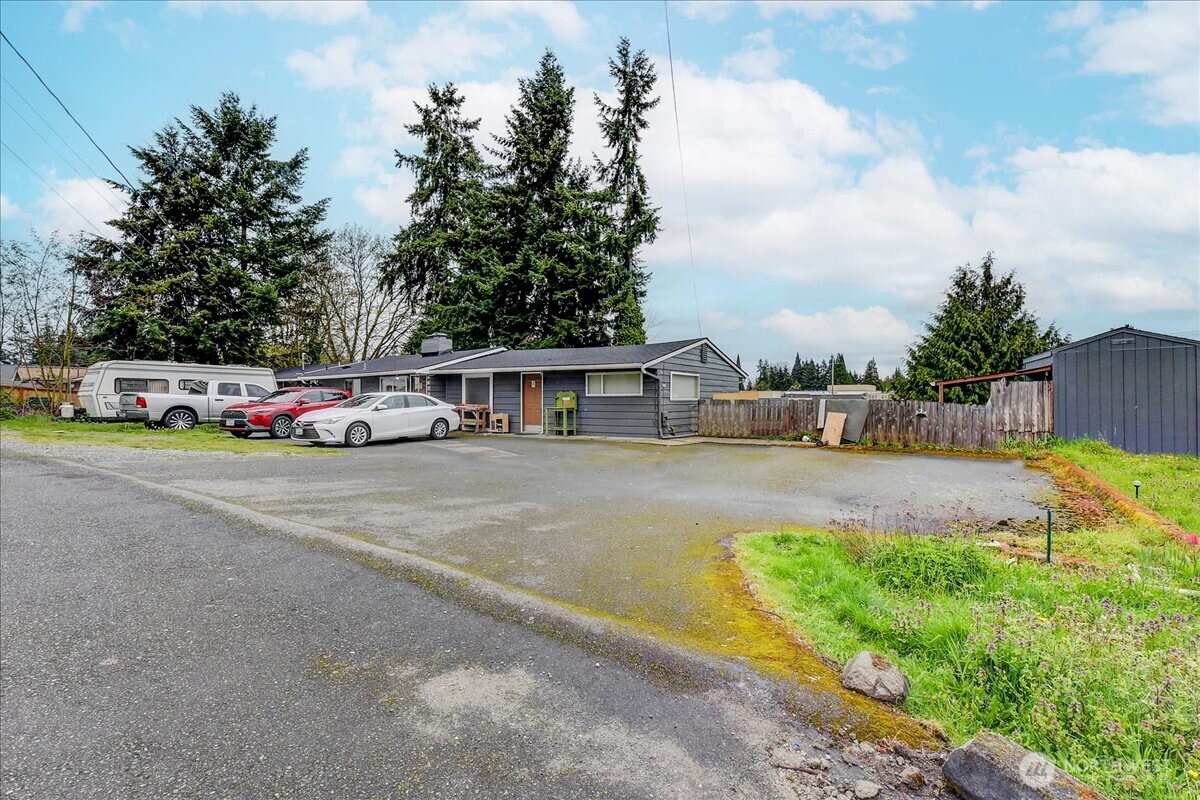 6629 204th Street Southwest Lynnwood, WA 98036 - Photo 1 of 17 a view of street with parked cars