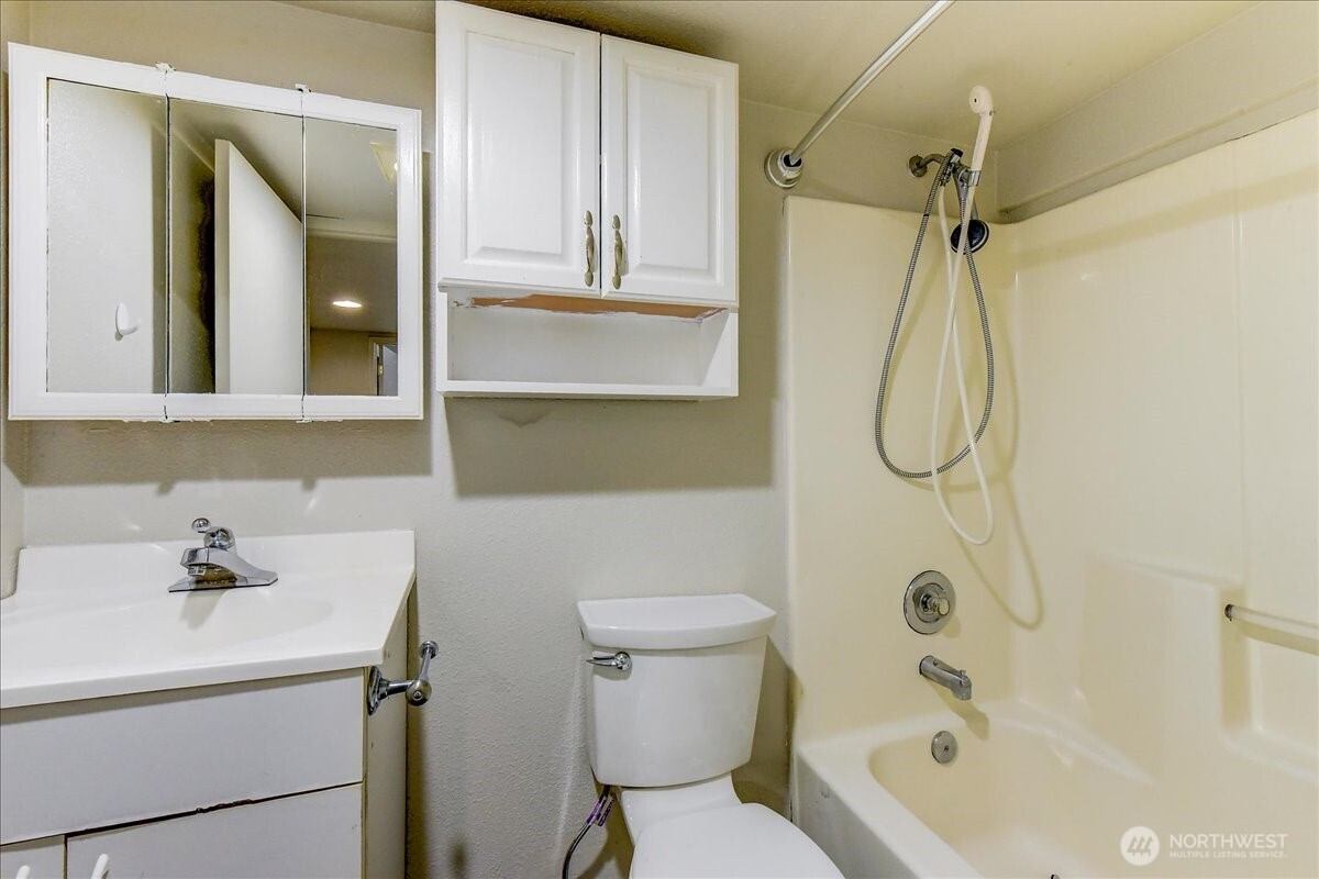 6629 204th Street Southwest Lynnwood, WA 98036 - Photo 9 of 17 a bathroom with a sink a toilet and shower