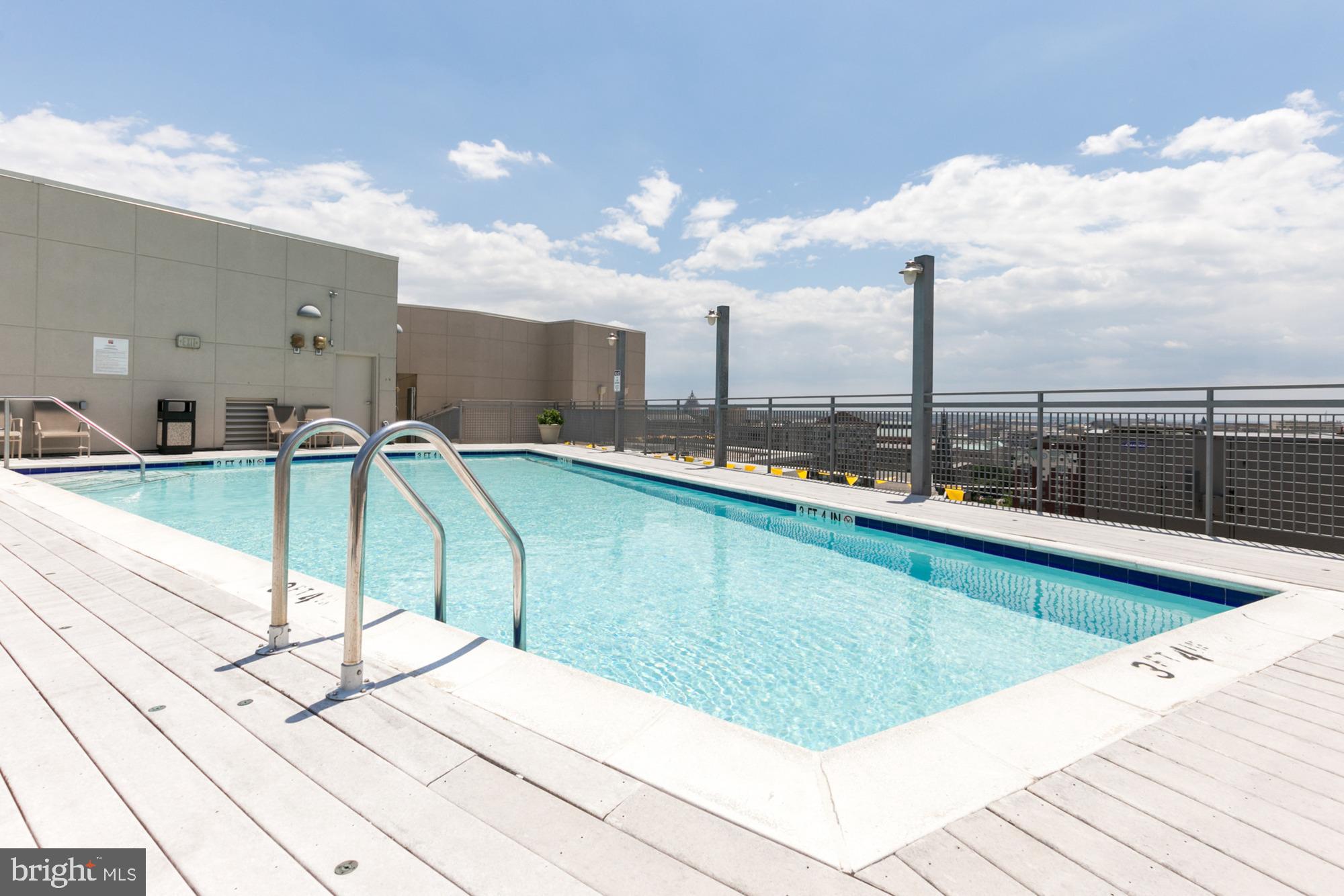 555 Massachusetts Avenue Northwest, Unit 1008 Washington, DC 20001 - Photo 4 of 15 a view of a swimming pool with a terrace