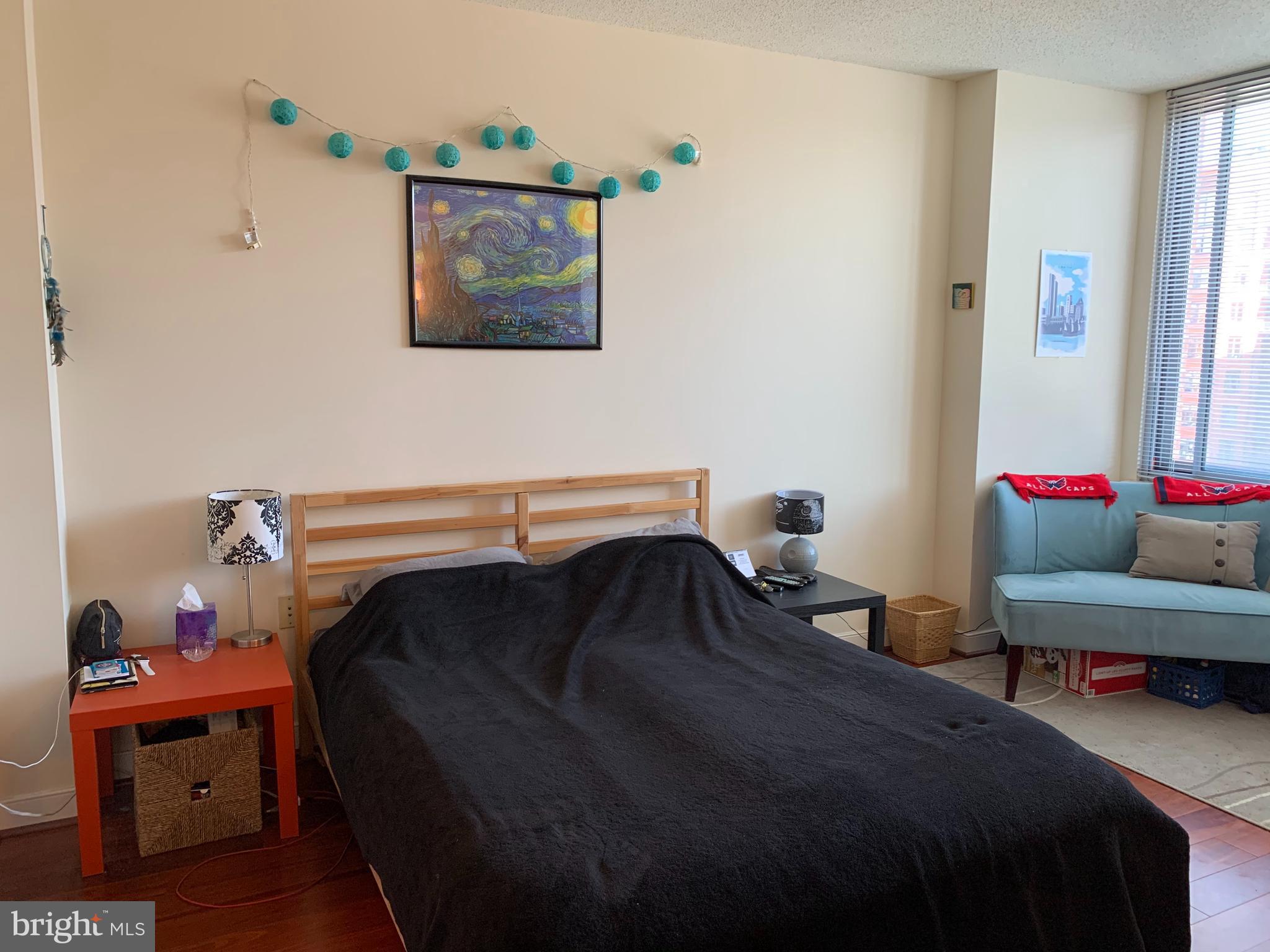 555 Massachusetts Avenue Northwest, Unit 1008 Washington, DC 20001 - Photo 8 of 15 a bedroom with a bed and a window