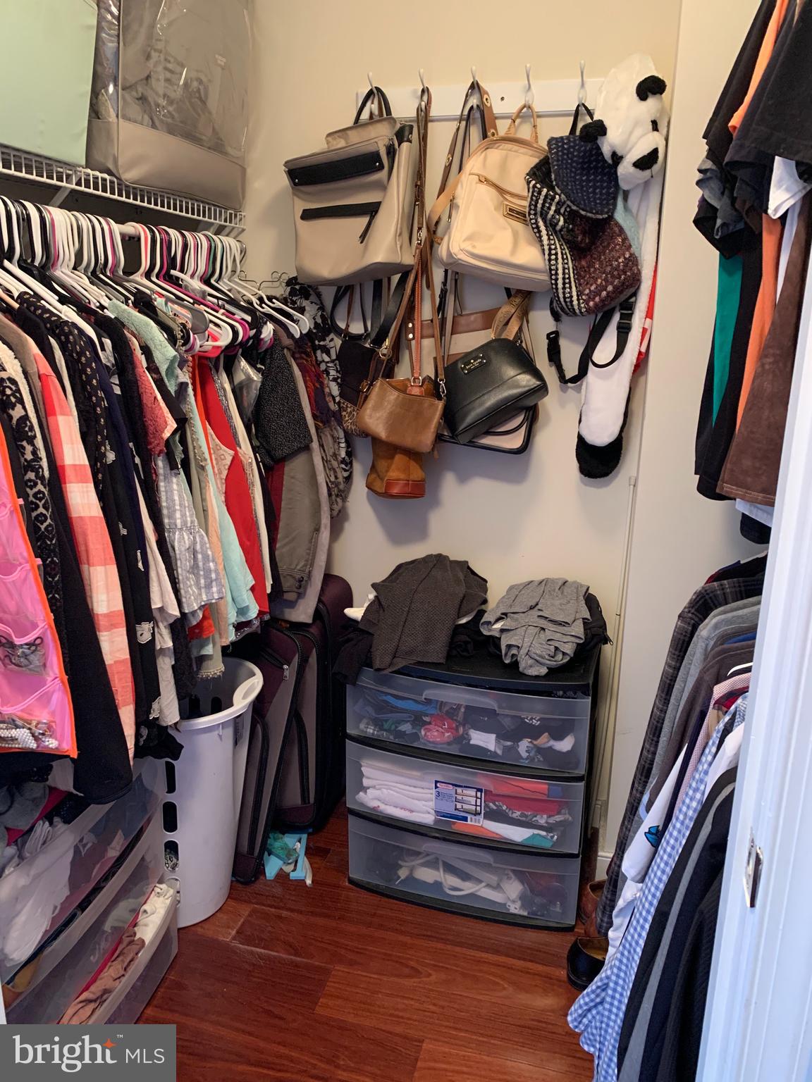 555 Massachusetts Avenue Northwest, Unit 1008 Washington, DC 20001 - Photo 9 of 15 a view of walk in closet with clothes and shoes