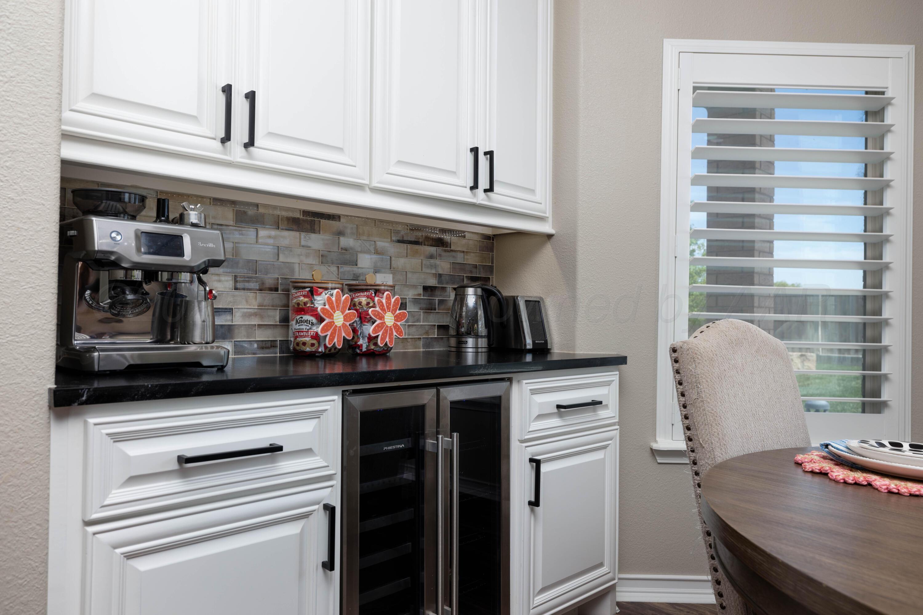 15201 Helium Road Amarillo, TX 79119 - Photo 17 of 61 a kitchen with stainless steel appliances granite countertop a stove and a refrigerator