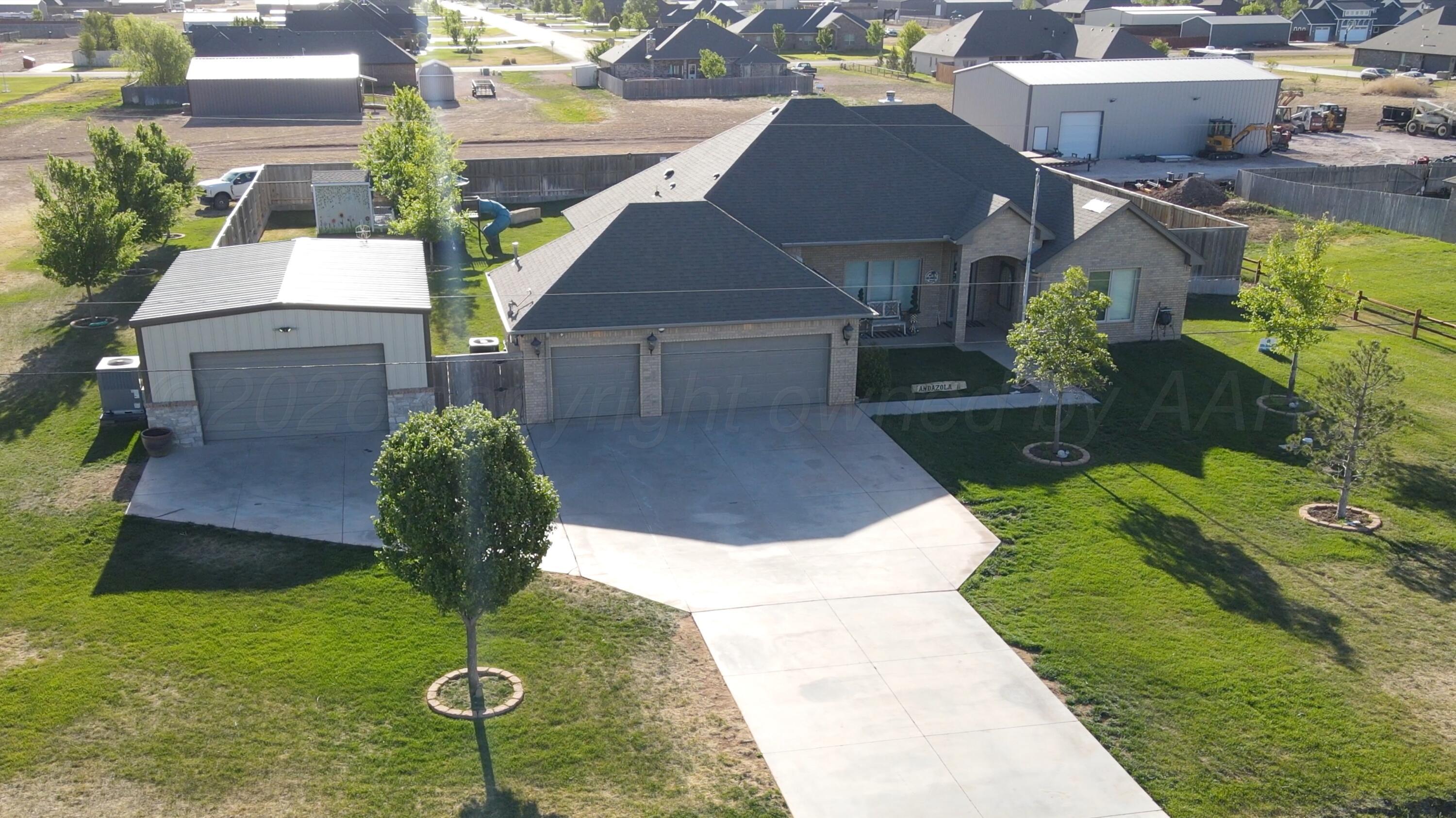 15201 Helium Road Amarillo, TX 79119 - Photo 2 of 61 a view of a yard in front of the house