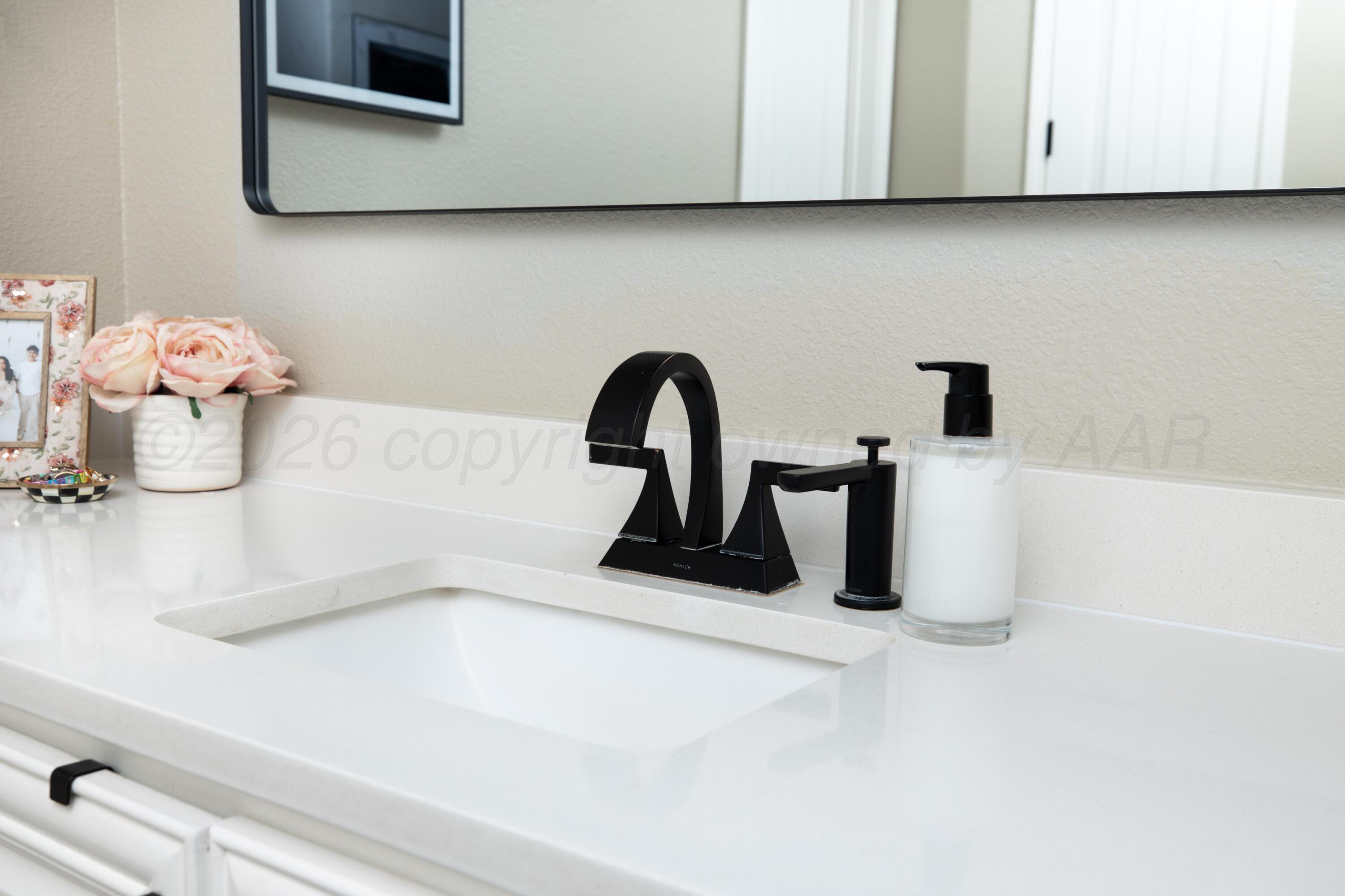 15201 Helium Road Amarillo, TX 79119 - Photo 24 of 61 a close view of a sink a microwave and cabinets