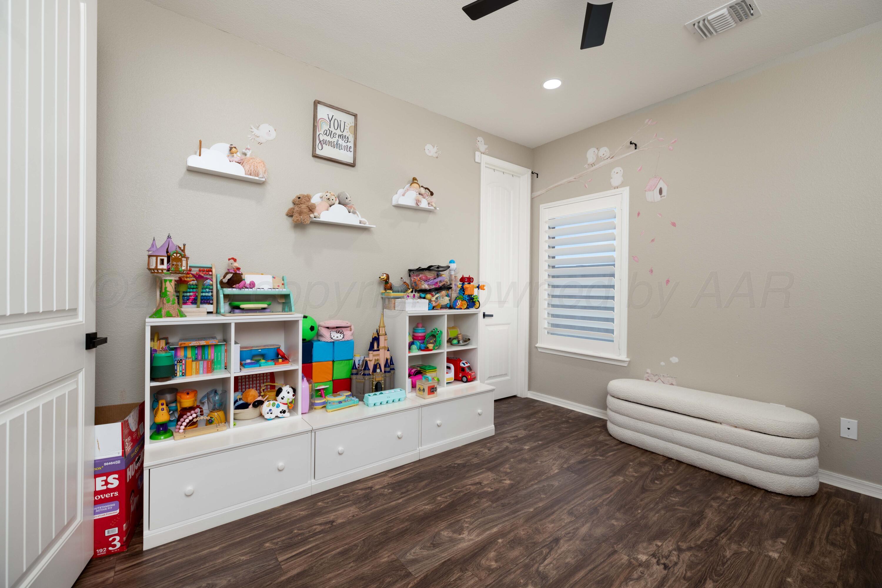 15201 Helium Road Amarillo, TX 79119 - Photo 31 of 61 a children room with toys and a wooden floor