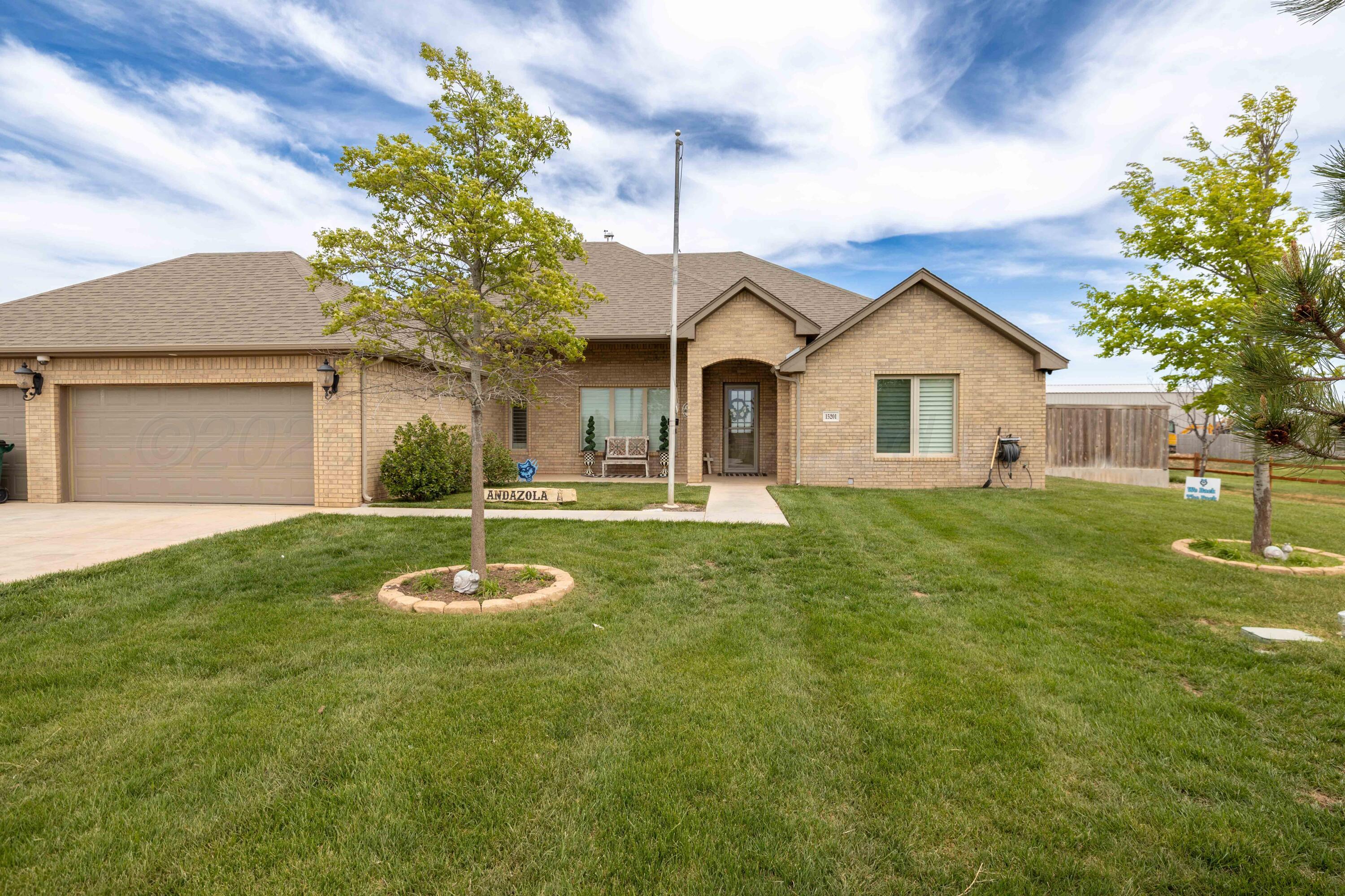 15201 Helium Road Amarillo, TX 79119 - Photo 4 of 61 a front view of a house with a yard