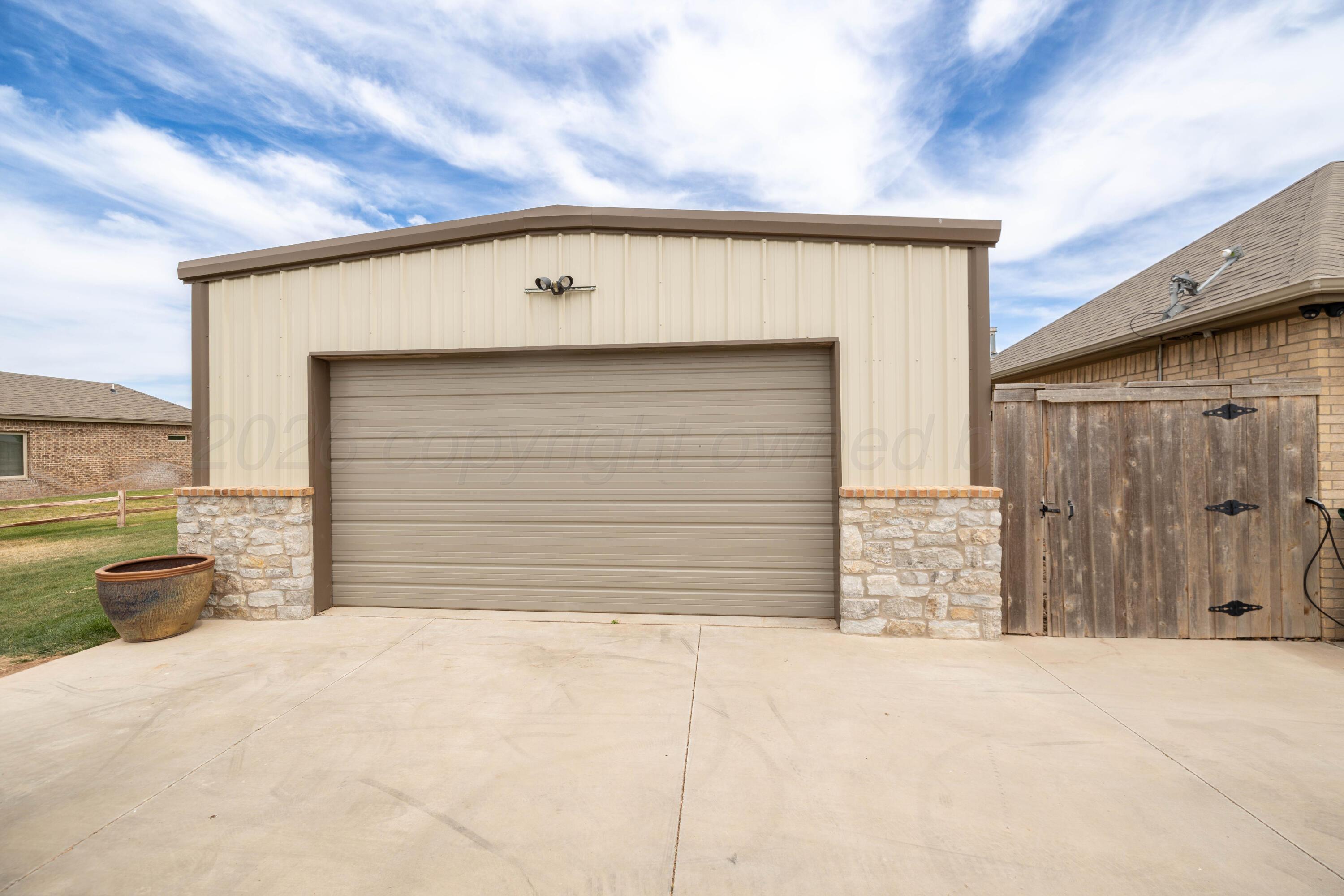 15201 Helium Road Amarillo, TX 79119 - Photo 41 of 61 a front view of a house with a garage