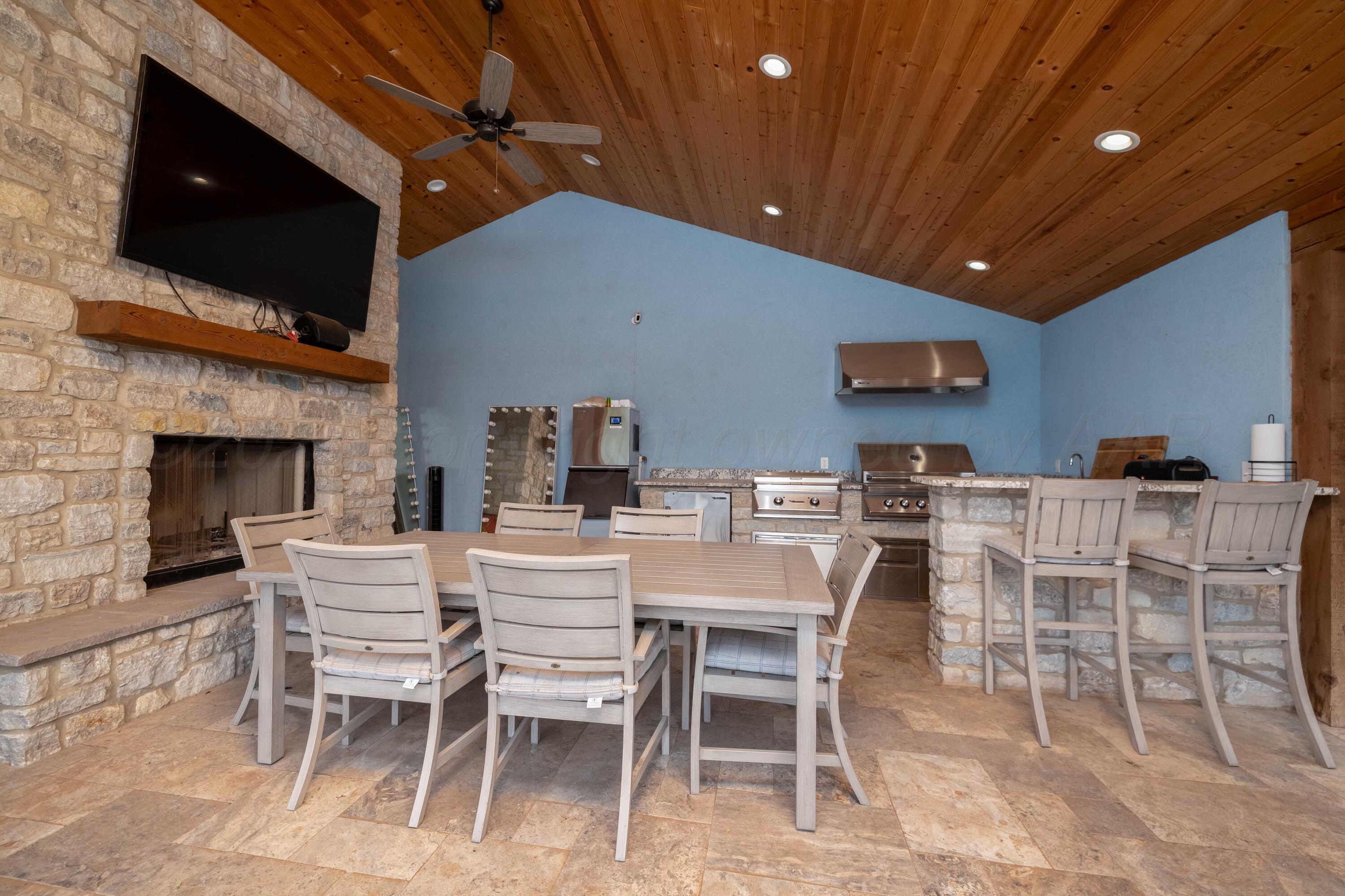 15201 Helium Road Amarillo, TX 79119 - Photo 48 of 61 a dining room with furniture and fireplace