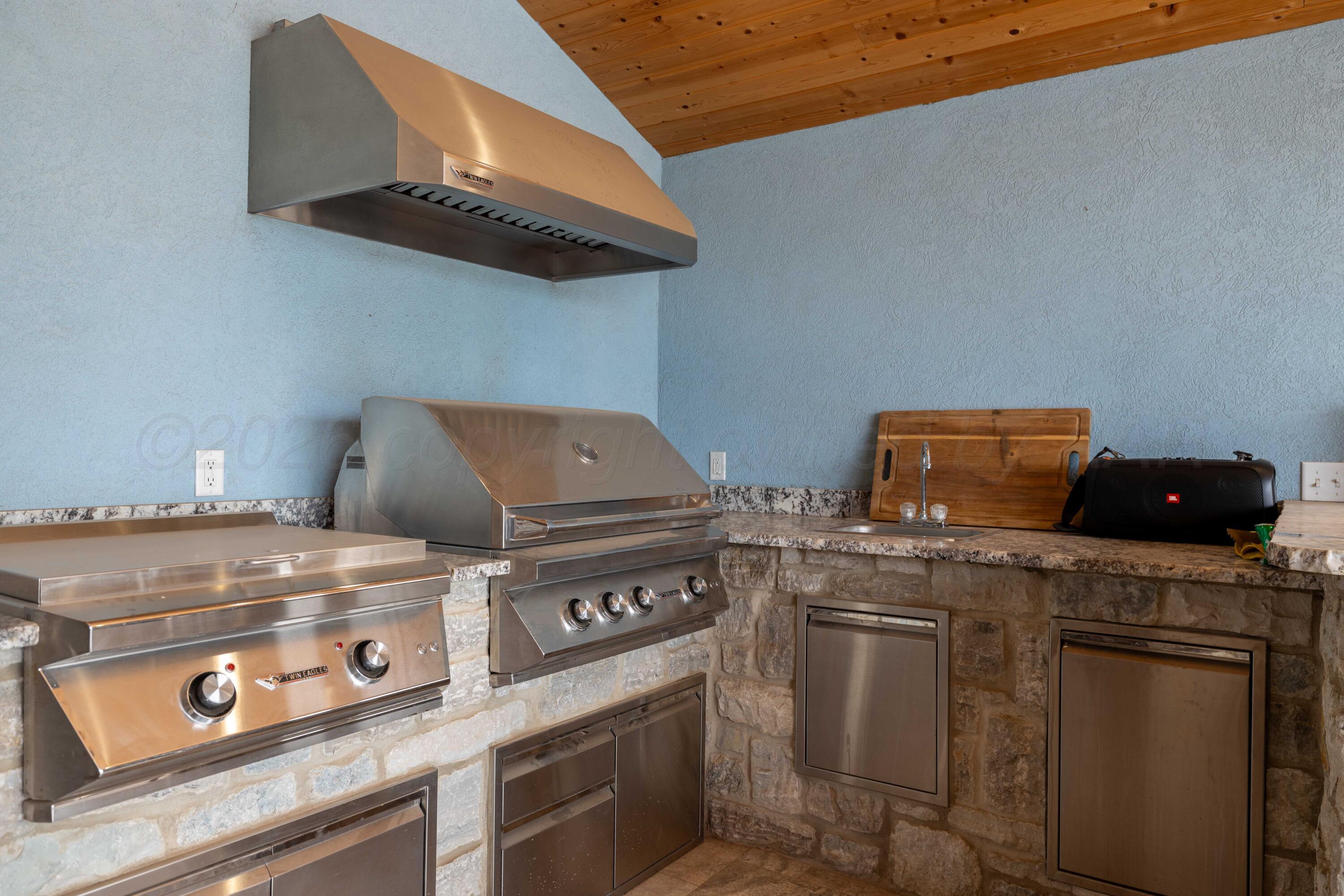 15201 Helium Road Amarillo, TX 79119 - Photo 51 of 61 a stove top oven sitting inside of a kitchen