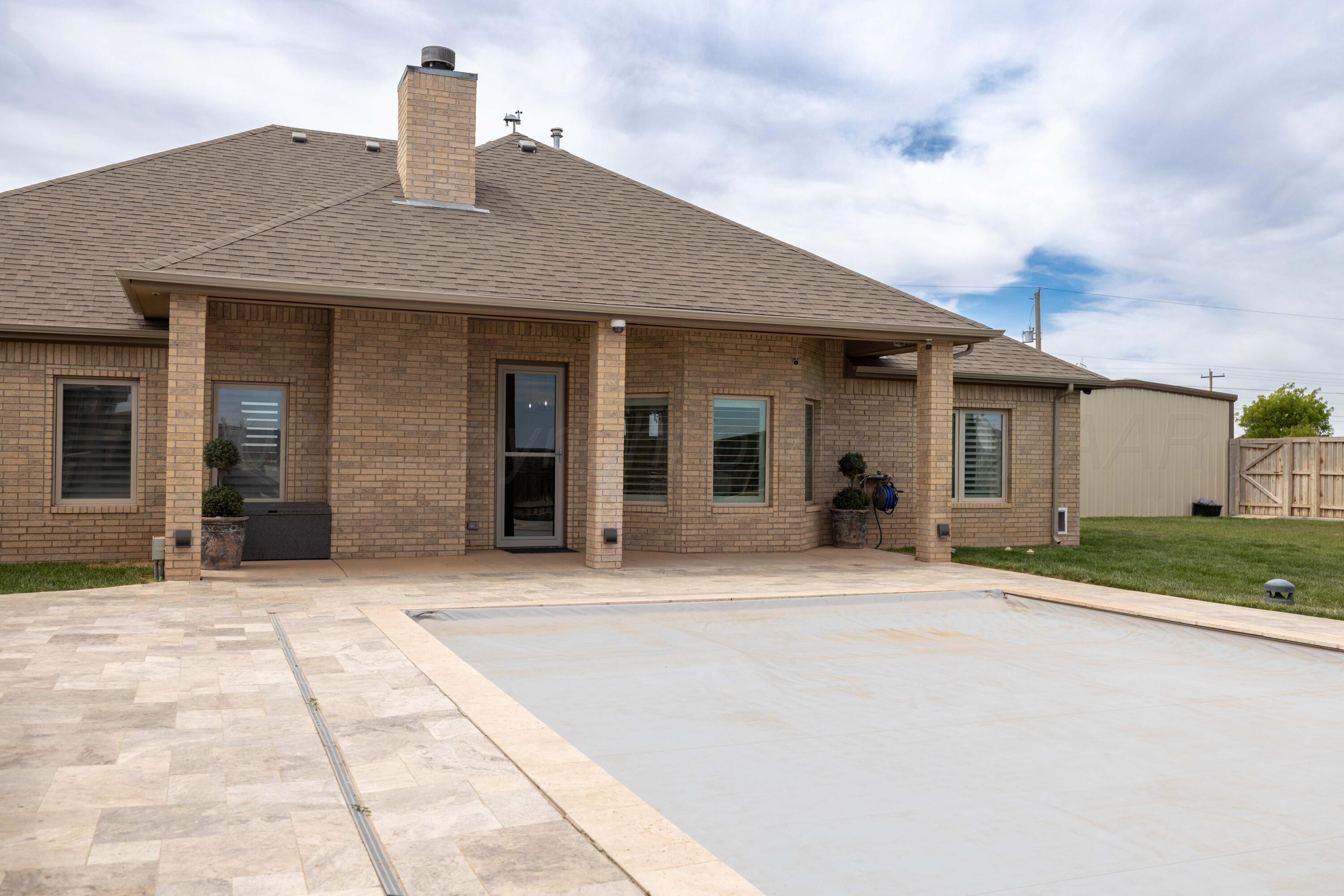 15201 Helium Road Amarillo, TX 79119 - Photo 52 of 61 a front view of a house with a garden