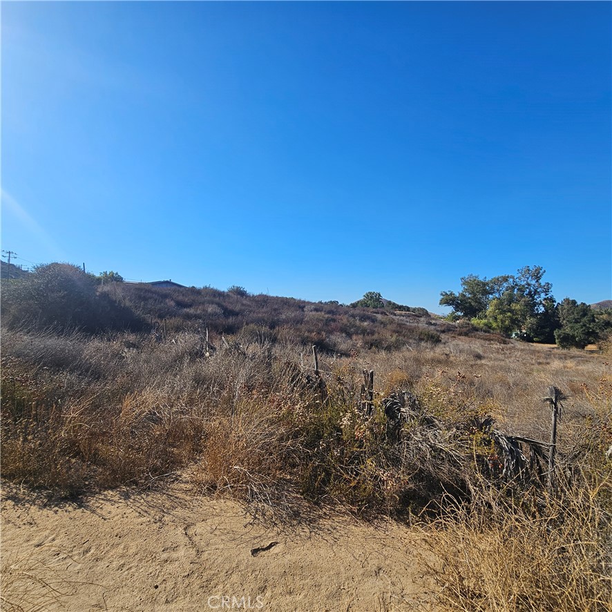 0 Locust Street Menifee, CA 92584 - Photo 4 of 11 View The 2nd Lot, Which Slopes Slightly Uphill, Walking Towards The Center Area Of Both Lots That Seem To Be Partially Fenced.