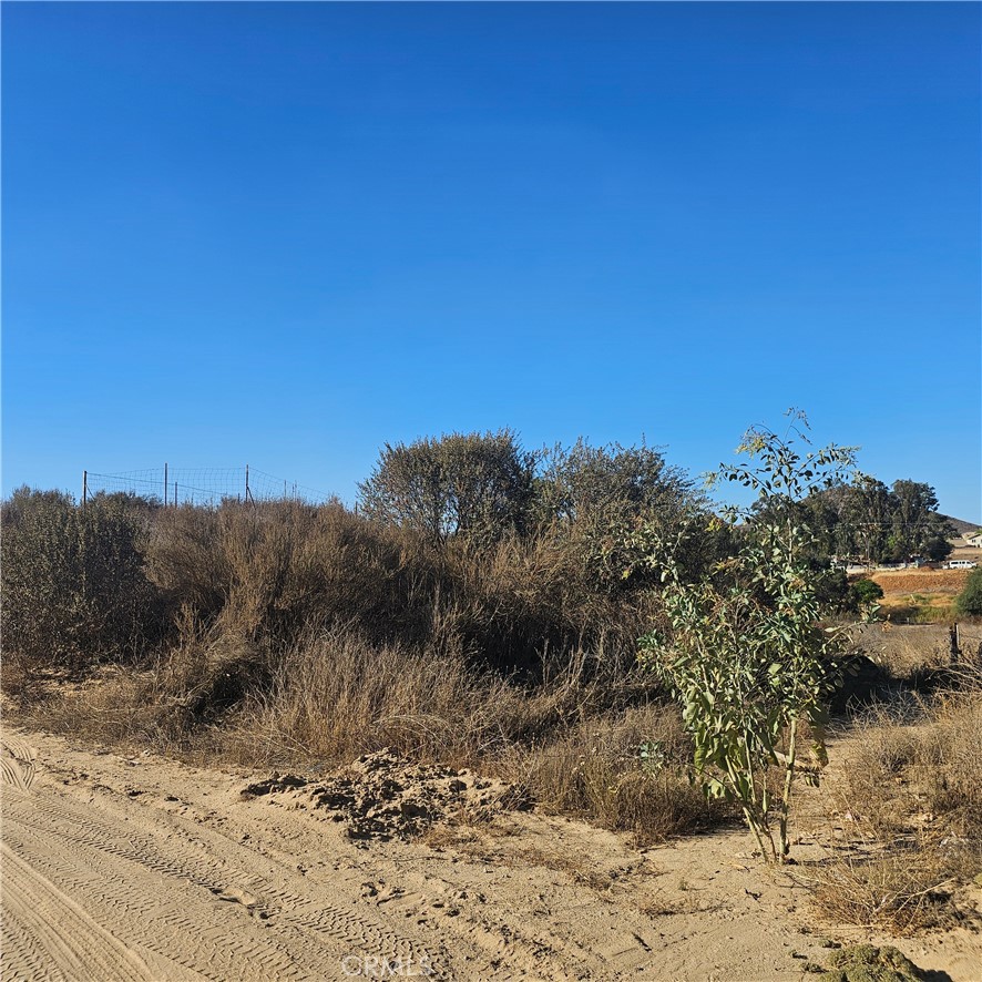 0 Locust Street Menifee, CA 92584 - Photo 10 of 11 On Locust St. View Of Lots Behind The Fence On The Right Side.