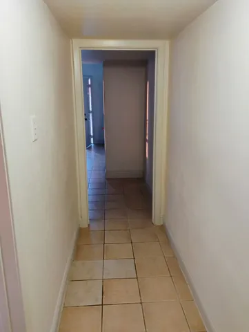 a view of a utility room with closet