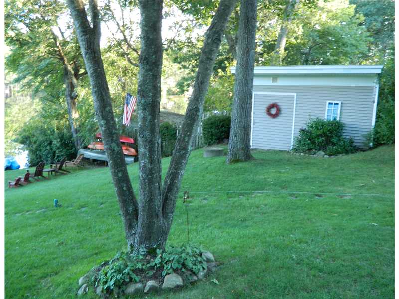 38 Pine Tree Road Coventry, RI 02816 - Photo 15 of 18 Yard/Garden. Very Large shed to store all your Water Toys and Boat Storage Rack for Kayaks and Canoes.