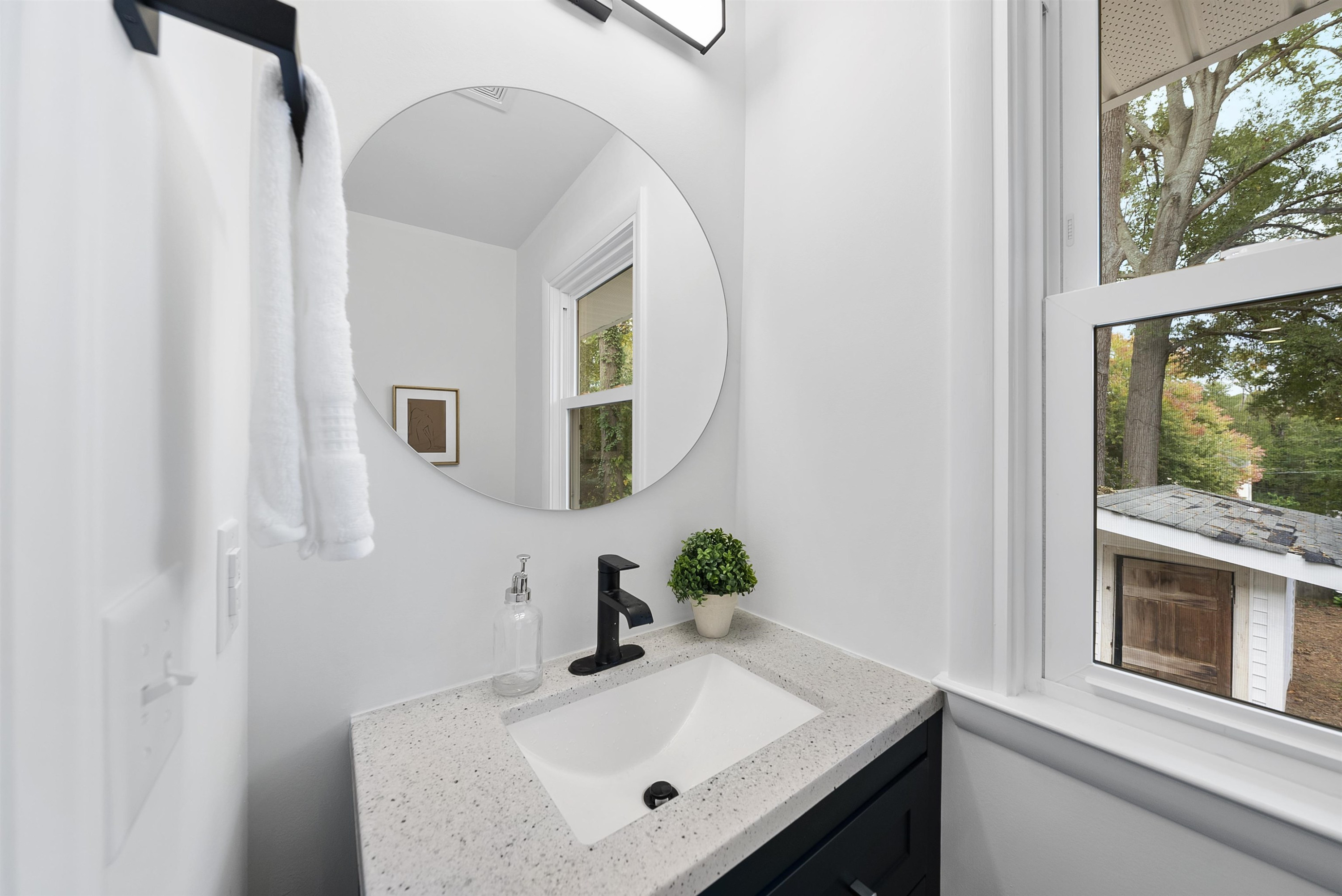 3128 Brentwood Road Raleigh, NC 27604 - Photo 14 of 28 a bathroom with a sink and a mirror