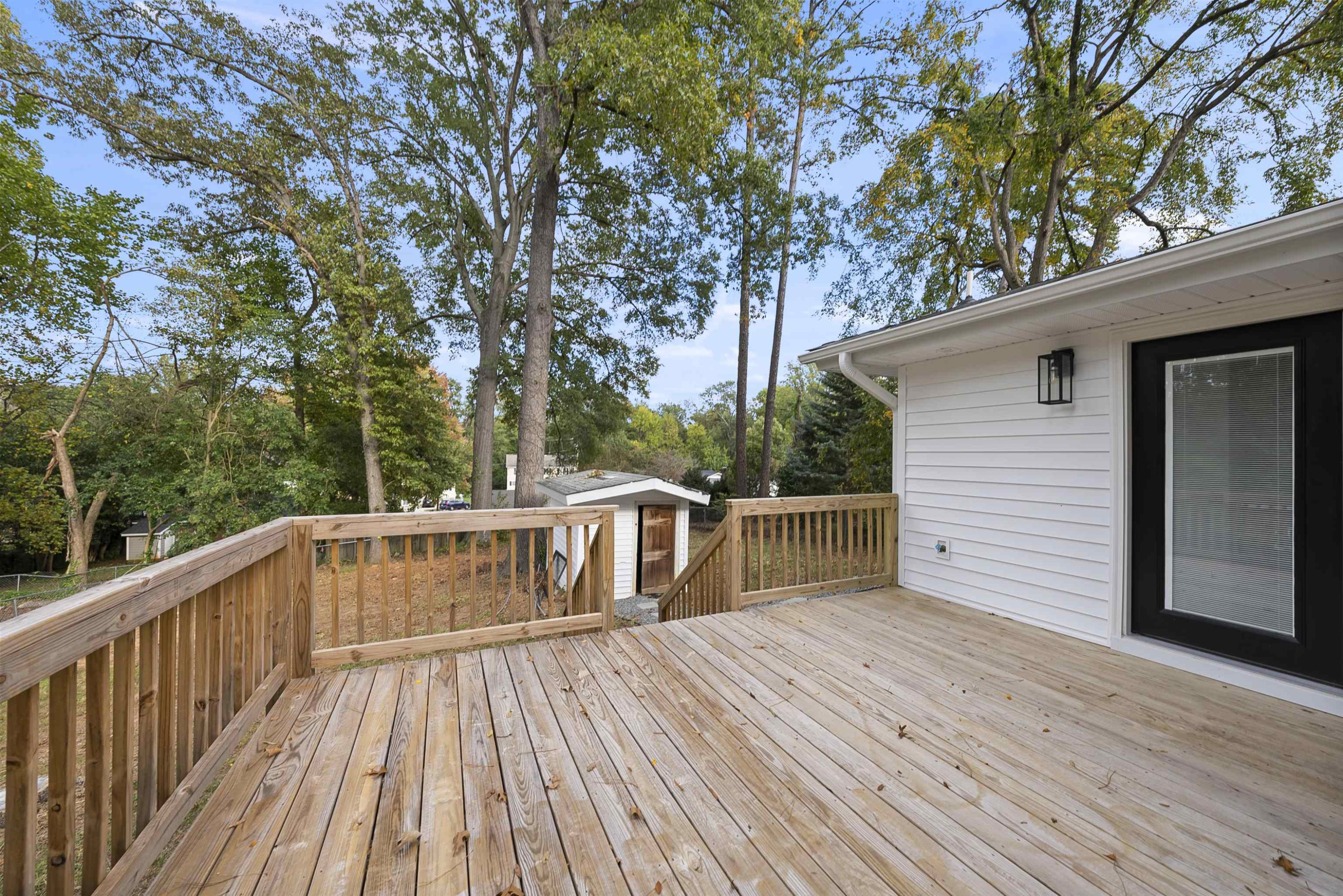 3128 Brentwood Road Raleigh, NC 27604 - Photo 16 of 28 a view of deck with a large pool and wooden fence