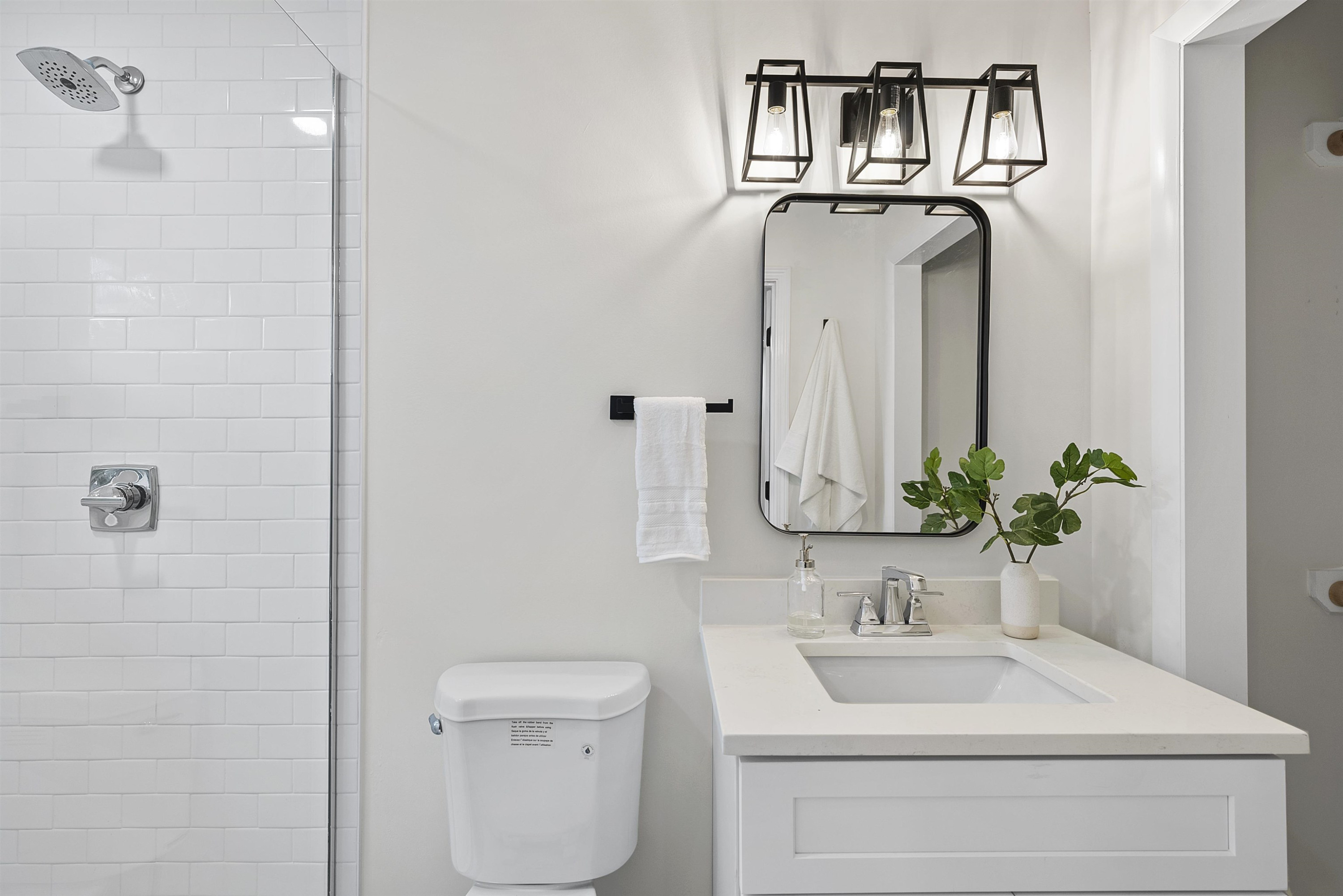 3128 Brentwood Road Raleigh, NC 27604 - Photo 24 of 28 a bathroom with a toilet sink and mirror