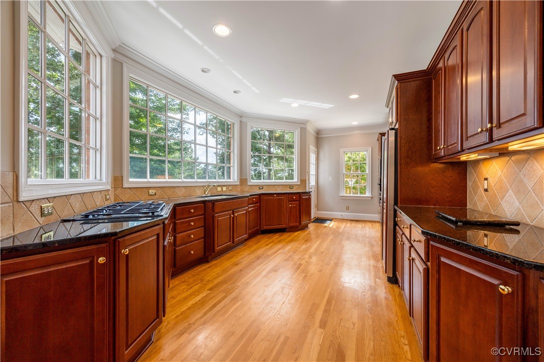 2619 Mulberry Row Road Midlothian, VA 23113 - Photo 13 of 49 a kitchen with stainless steel appliances granite countertop wooden floors and sink