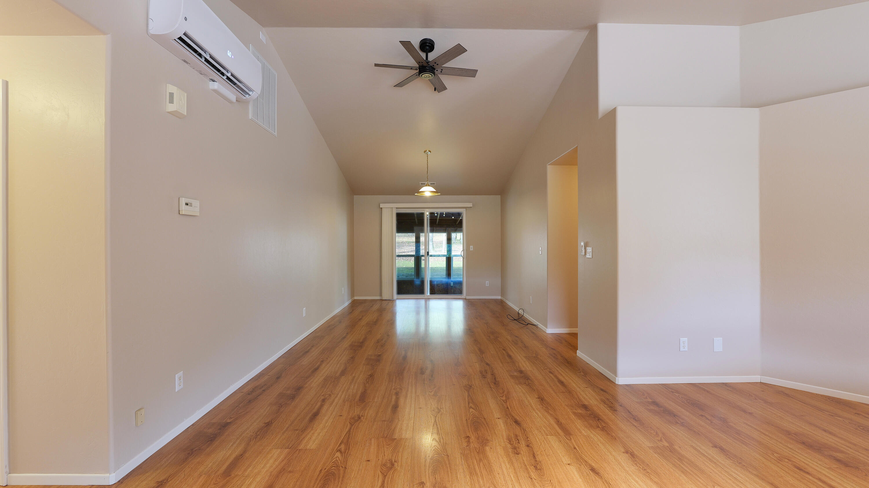 204 Shipley Terrace Prospect, OR 97536 - Photo 17 of 61 a view of a hallway with wooden floor and a chandelier