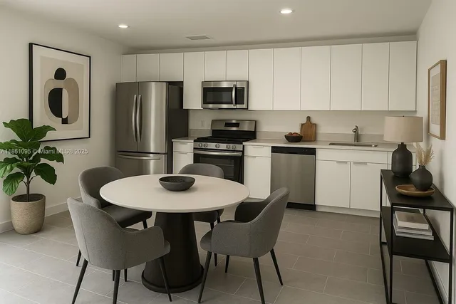 a kitchen with a table and chairs