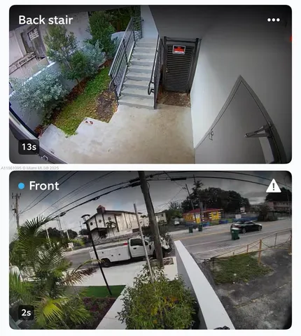 an aerial view of a house with outdoor space