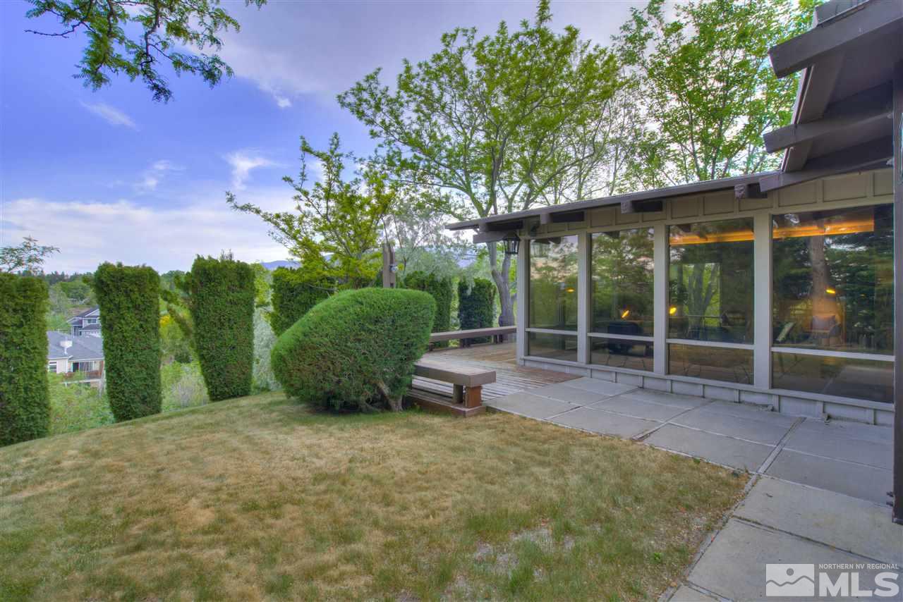 2395 Crescent Reno, NV 89509 - Photo 34 of 40 a view of a backyard with plants and a patio