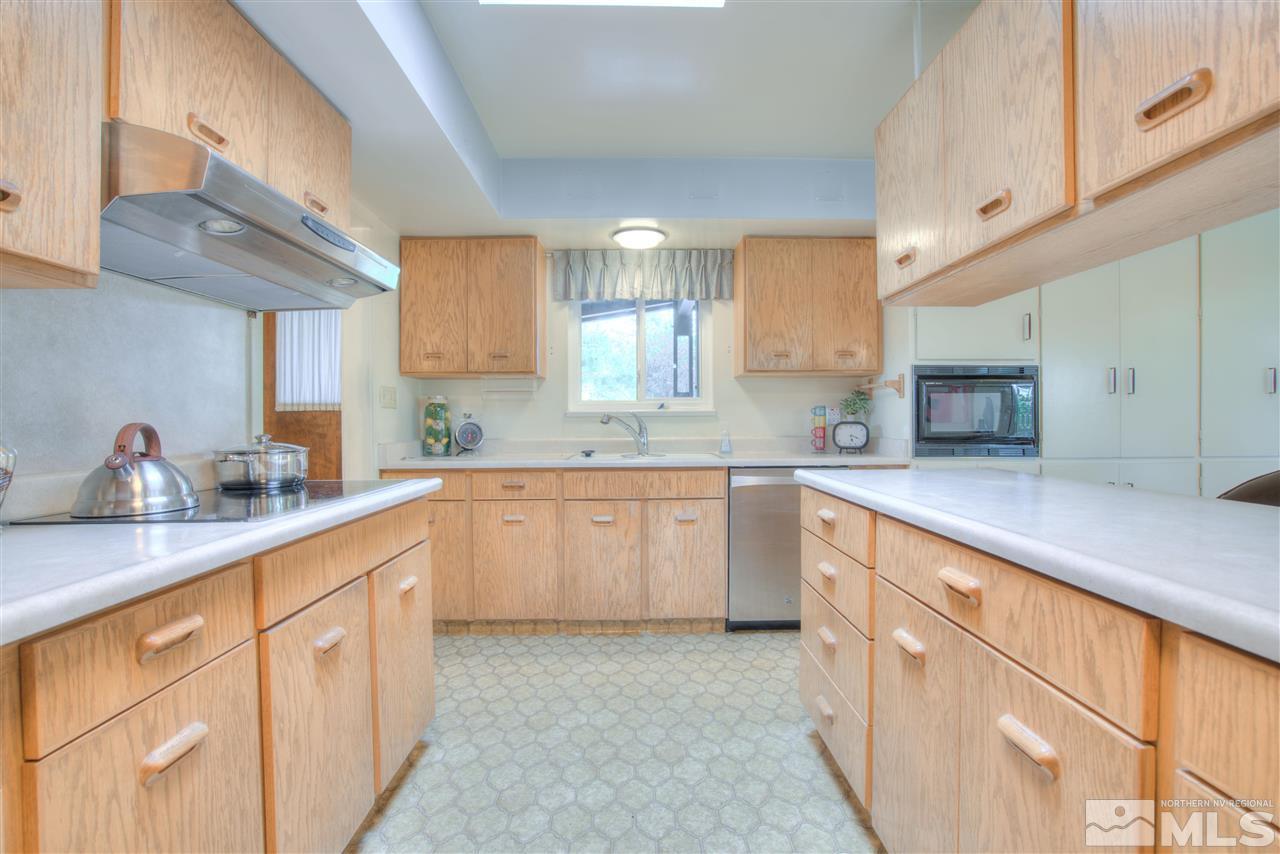 2395 Crescent Reno, NV 89509 - Photo 8 of 40 a kitchen with cabinets appliances a sink and a window