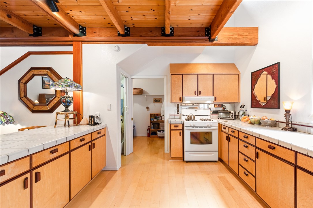 16366 Morro Road Atascadero, CA 93422 - Photo 11 of 69 a kitchen with a sink and a stove top oven