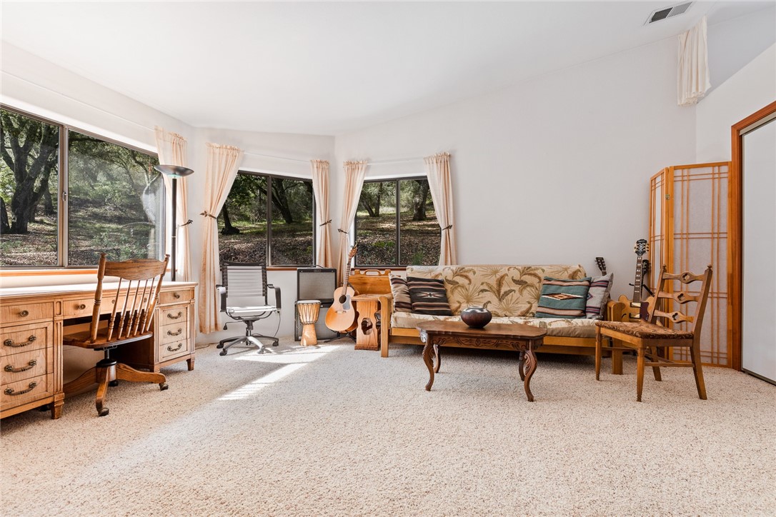 16366 Morro Road Atascadero, CA 93422 - Photo 14 of 69 a living room with furniture and a flat screen tv