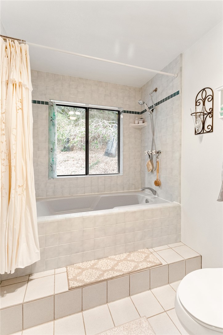 16366 Morro Road Atascadero, CA 93422 - Photo 17 of 69 a bathroom with a bathtub and a shower