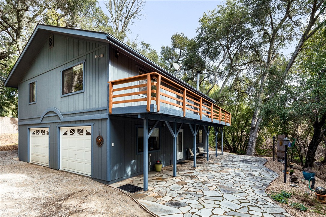 16366 Morro Road Atascadero, CA 93422 - Photo 26 of 69 a view of a house with a patio and backyard