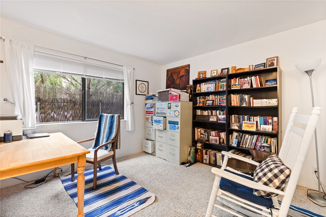 16366 Morro Road Atascadero, CA 93422 - Photo 44 of 69 a view of a workspace with furniture and a bookshelf