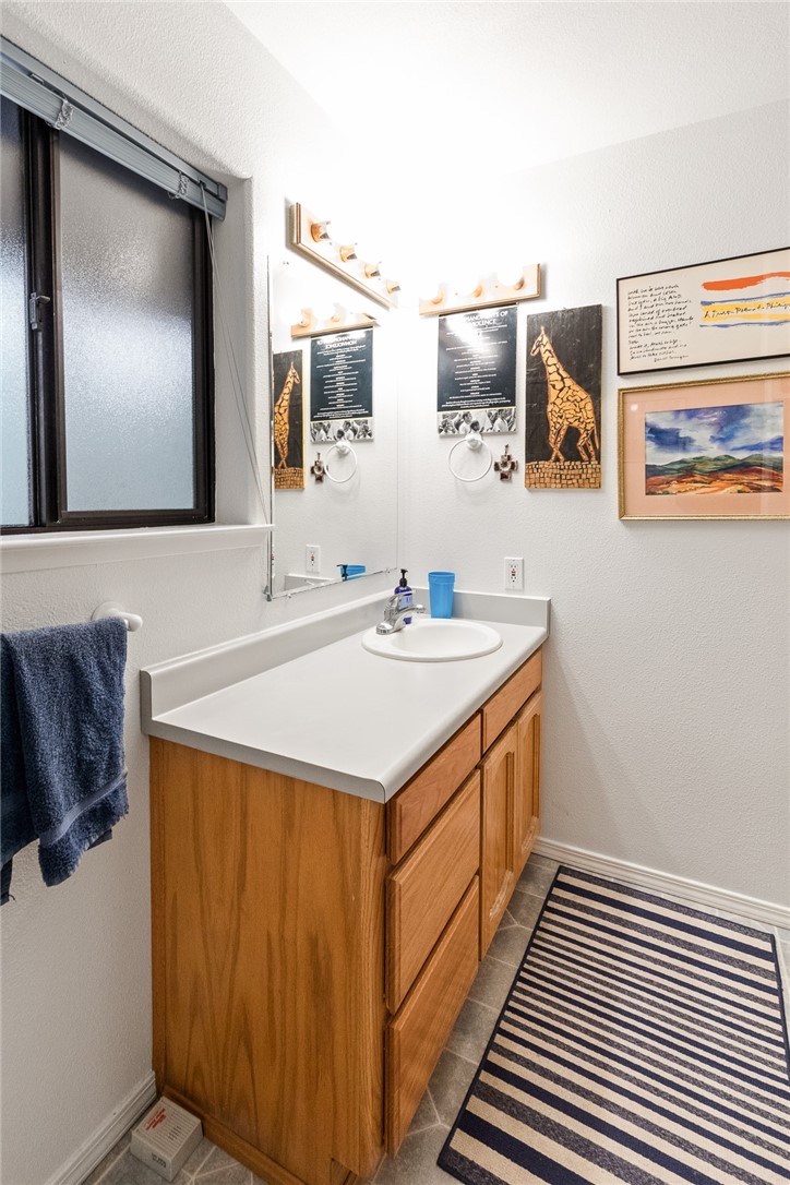 16366 Morro Road Atascadero, CA 93422 - Photo 45 of 69 a bathroom with a sink and a mirror