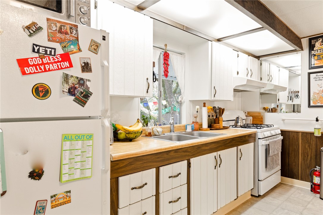 16366 Morro Road Atascadero, CA 93422 - Photo 54 of 69 a kitchen with a sink and a stove top oven