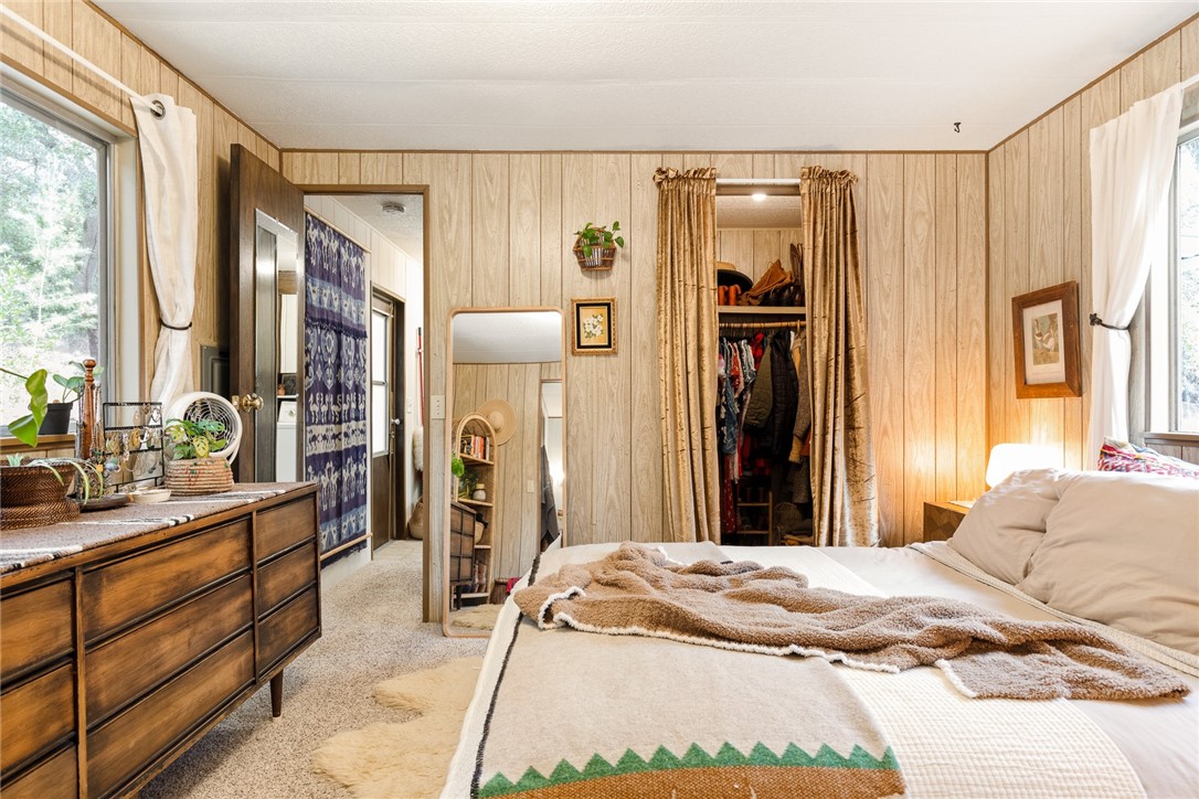 16366 Morro Road Atascadero, CA 93422 - Photo 56 of 69 a bedroom with a large bed and a large mirror