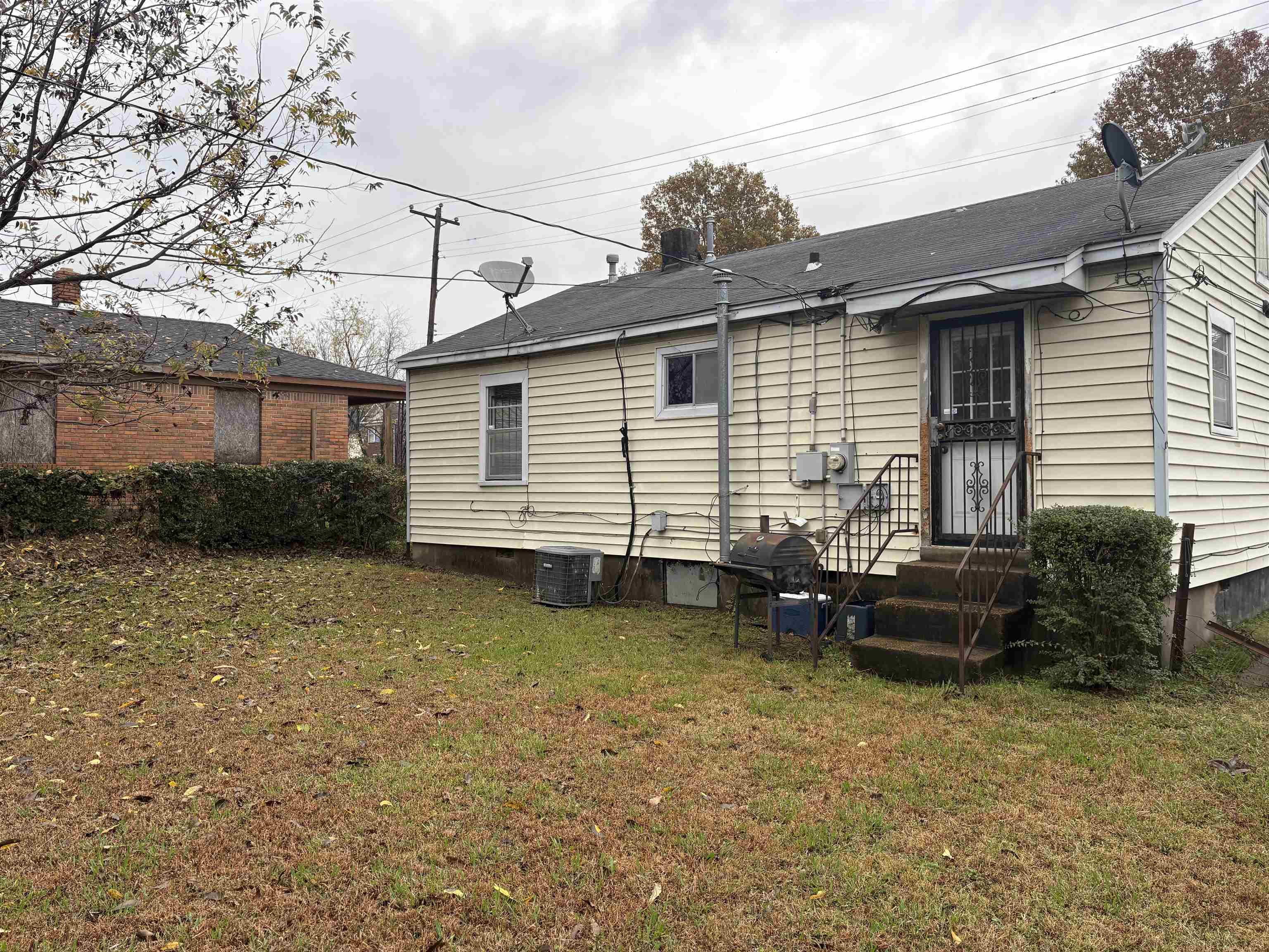 1509 Ragan Street Memphis, TN 38106 - Photo 16 of 17 Back of house featuring a lawn and crawl space