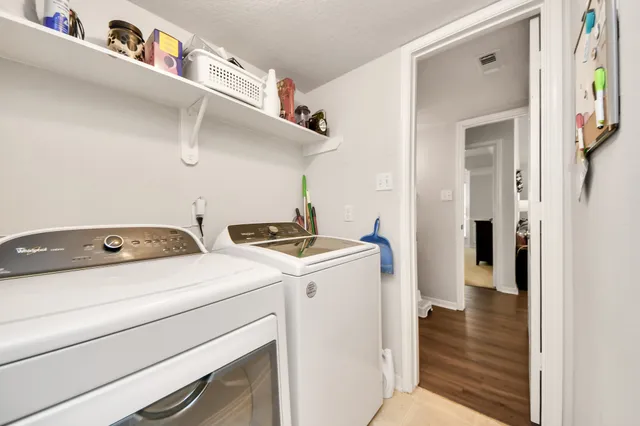 a utility room with dryer and washer