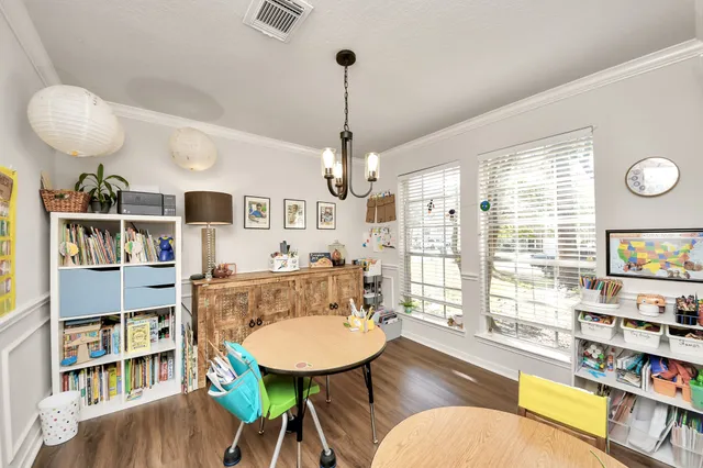 a living room with furniture a rug and a large window