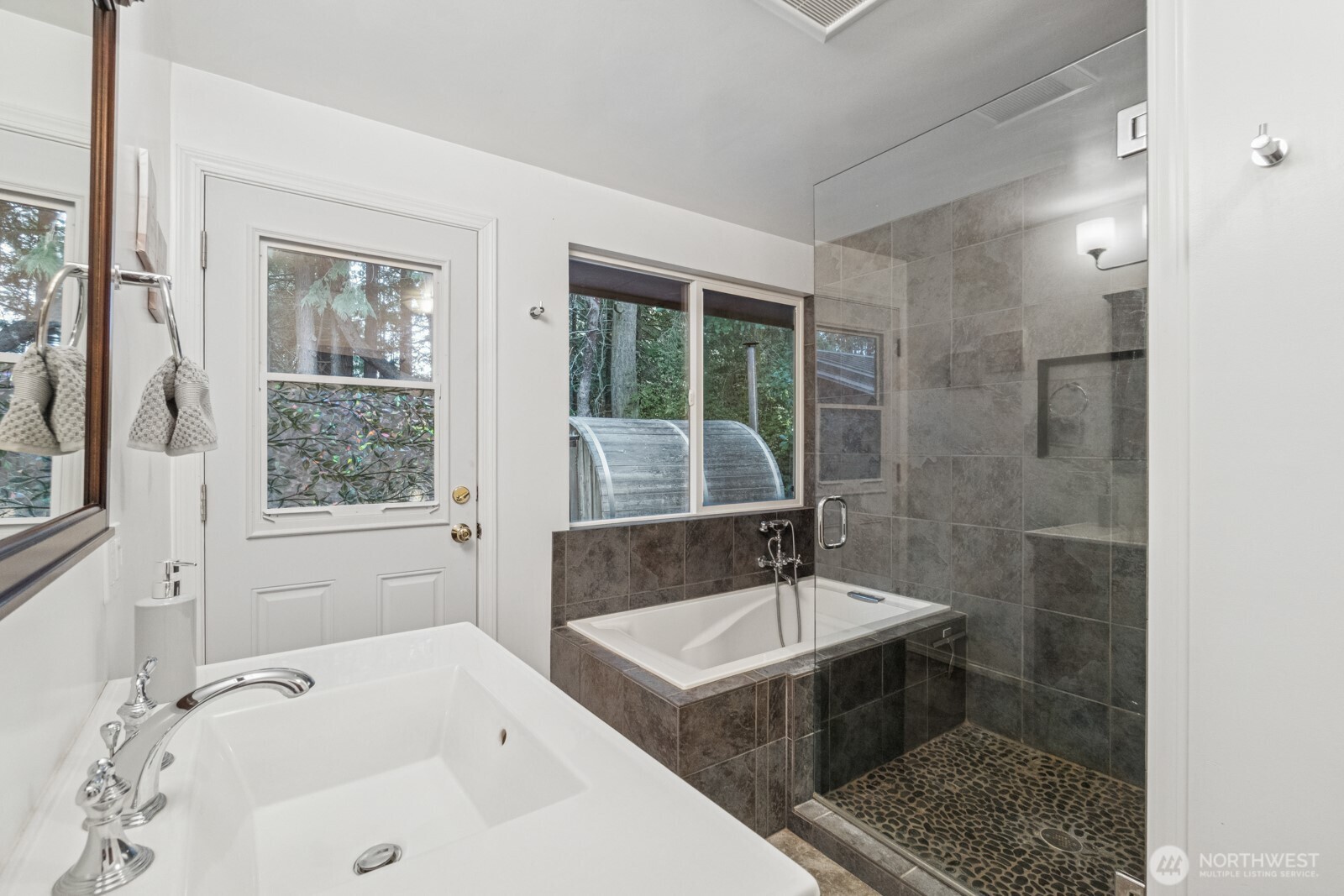 71 Quinault Loop Port Townsend, WA 98368 - Photo 15 of 29 a bathroom with a tub sink and window