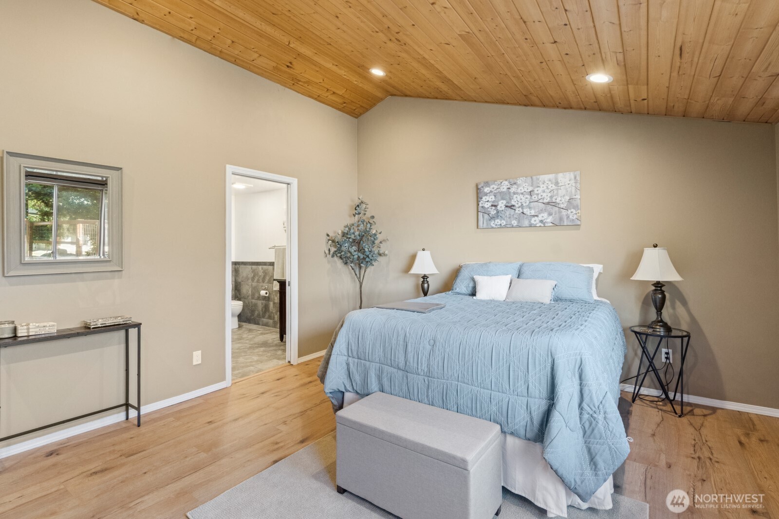 71 Quinault Loop Port Townsend, WA 98368 - Photo 17 of 29 a bedroom with a bed and painting on the wall