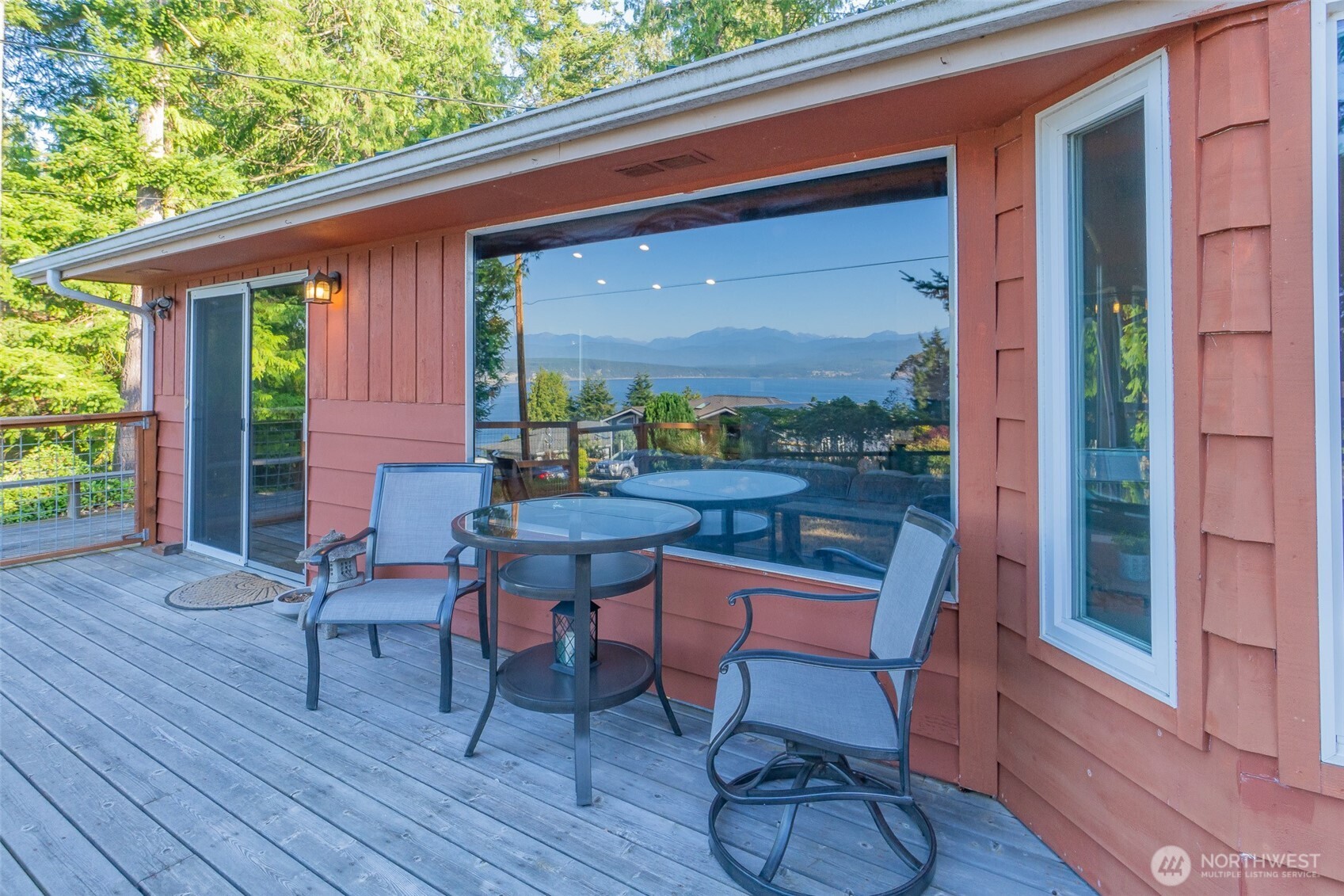 71 Quinault Loop Port Townsend, WA 98368 - Photo 2 of 29 a balcony with table and chairs