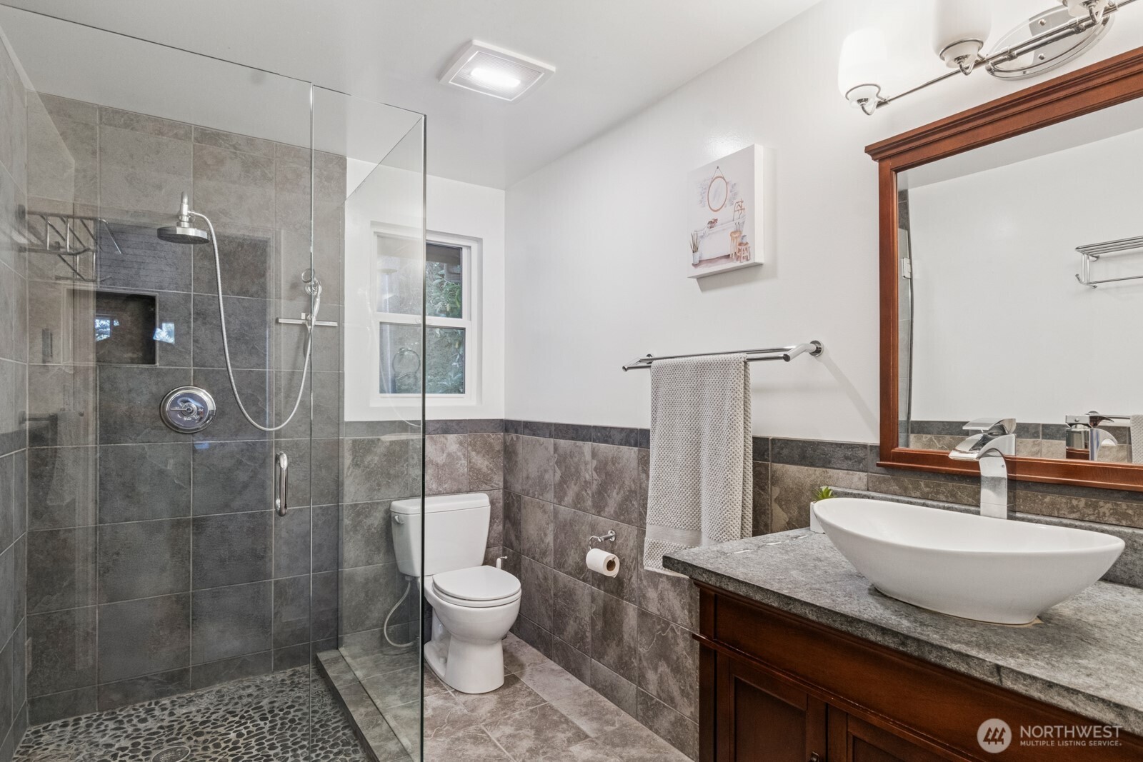 71 Quinault Loop Port Townsend, WA 98368 - Photo 21 of 29 a bathroom with a granite countertop sink toilet and shower